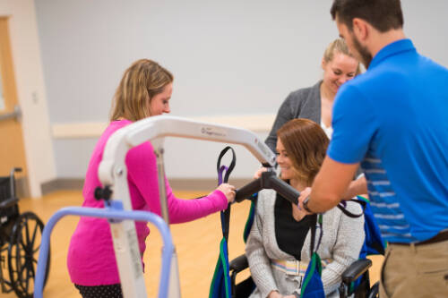 students practice with disability support equipment